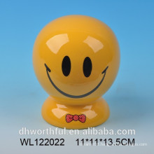 Ceramic smiling face coin bank